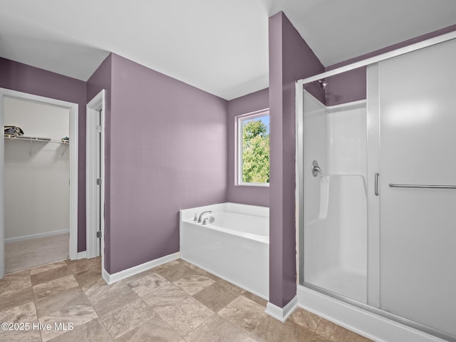 301 Stella Bridgeway Dr, Stella, NC 28582 - bathroom with a stall shower, a garden tub, and a walk in closet