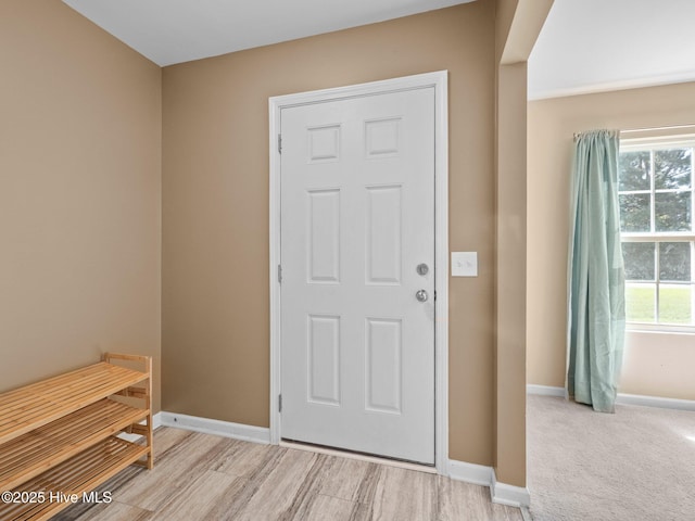 301 Stella Bridgeway Dr, Stella, NC 28582 - foyer with baseboards and light wood-style flooring