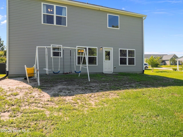 301 Stella Bridgeway Dr, Stella, NC 28582 - rear view of property featuring a yard