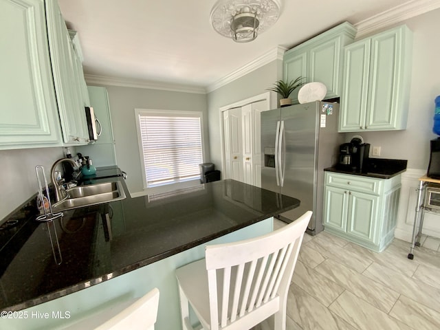 2911 E Pelican Dr, Oak Island, NC 28465 - kitchen with stainless steel appliances, a peninsula, a kitchen breakfast bar, and crown molding