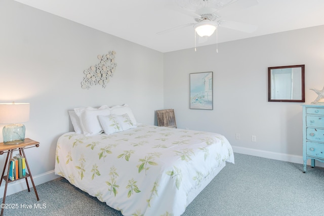 2911 E Pelican Dr, Oak Island, NC 28465 - carpeted bedroom with baseboards and ceiling fan