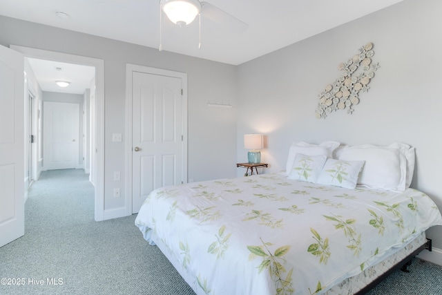 2911 E Pelican Dr, Oak Island, NC 28465 - bedroom with light colored carpet and a ceiling fan
