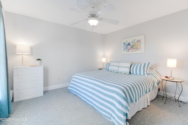 2911 E Pelican Dr, Oak Island, NC 28465 - carpeted bedroom with baseboards and a ceiling fan
