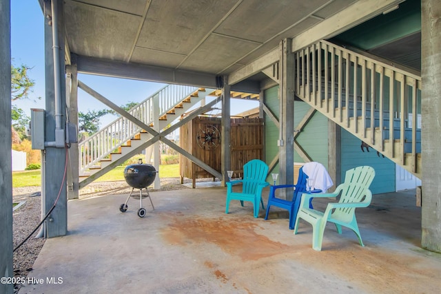 2911 E Pelican Dr, Oak Island, NC 28465 - view of patio / terrace featuring stairway