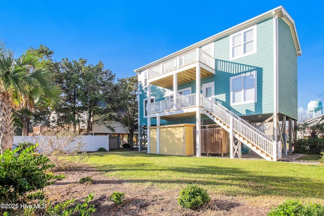 2911 E Pelican Dr, Oak Island, NC 28465 - rear view of house with a balcony and stairs
