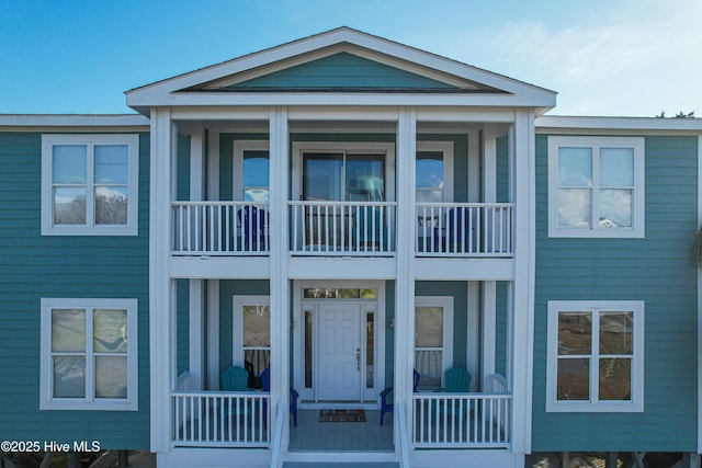 2911 E Pelican Dr, Oak Island, NC 28465 - view of front of home with a balcony