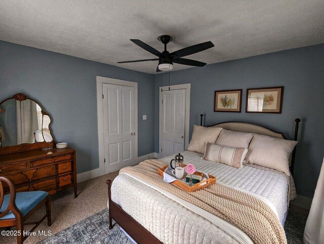 750 W 2nd St, Washington, NC 27889 - carpeted bedroom featuring a textured ceiling, baseboards, and a ceiling fan