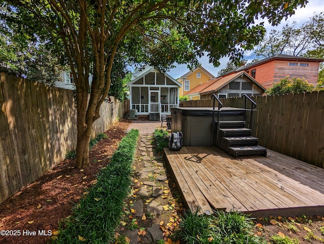 750 W 2nd St, Washington, NC 27889 - fenced backyard featuring a hot tub, a sunroom, and a wooden deck