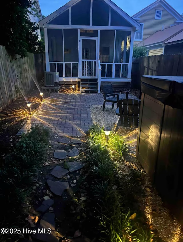 750 W 2nd St, Washington, NC 27889 - rear view of house with a sunroom, a fenced backyard, and a patio