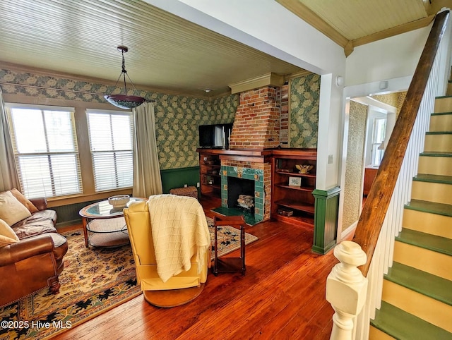 750 W 2nd St, Washington, NC 27889 - living area featuring ornamental molding, wallpapered walls, stairs, hardwood / wood-style flooring, and a fireplace