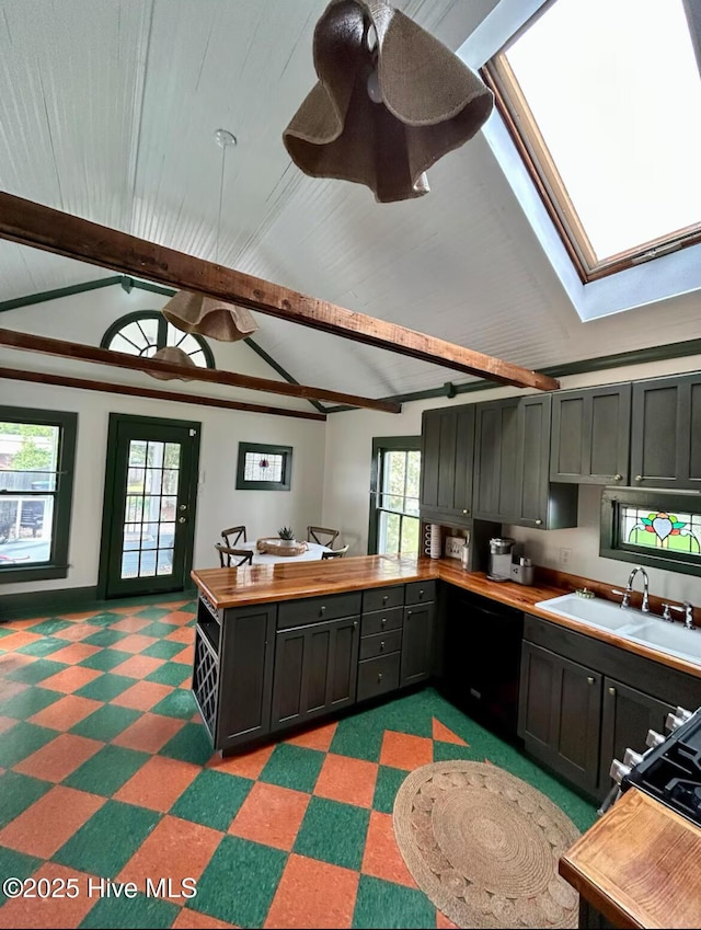 750 W 2nd St, Washington, NC 27889 - kitchen featuring a sink, light flooring, butcher block countertops, and a ceiling fan