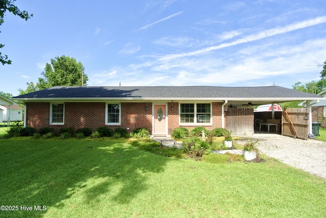 1307 Hunters Rd, New Bern, NC 28562 - ranch-style home featuring an attached carport, gravel driveway, brick siding, and ceiling fan