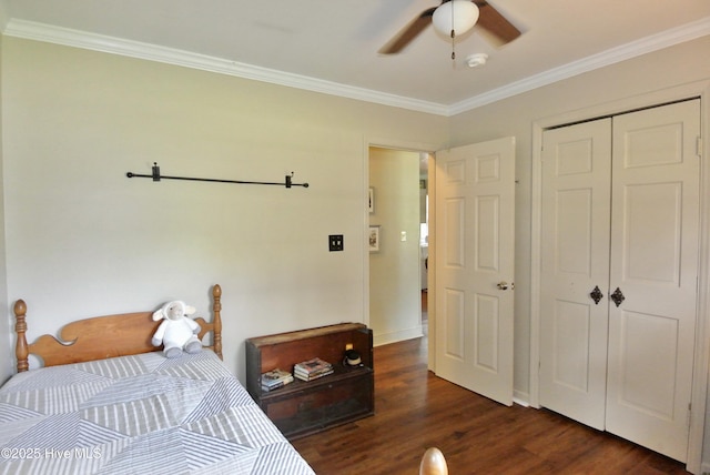 1307 Hunters Rd, New Bern, NC 28562 - bedroom featuring dark wood finished floors, a closet, ornamental molding, and a ceiling fan