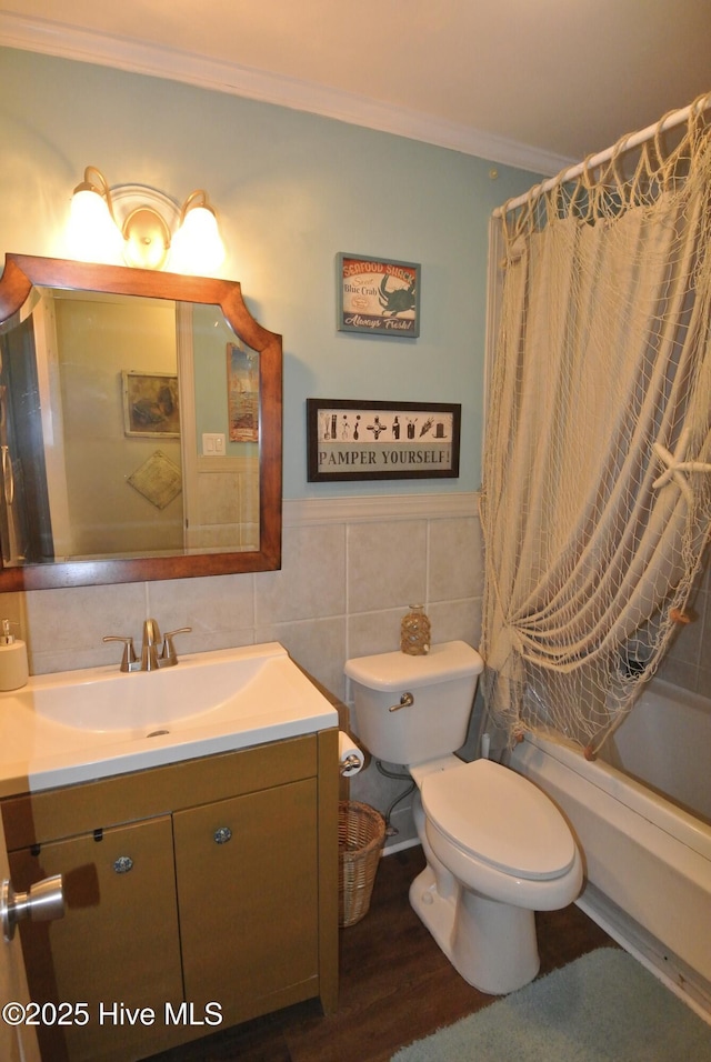 1307 Hunters Rd, New Bern, NC 28562 - full bathroom featuring vanity, crown molding, shower / tub combo, tile walls, and wood finished floors