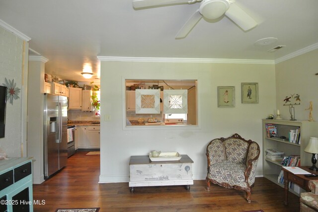 1307 Hunters Rd, New Bern, NC 28562 - sitting room with crown molding, a ceiling fan, and dark wood-style flooring