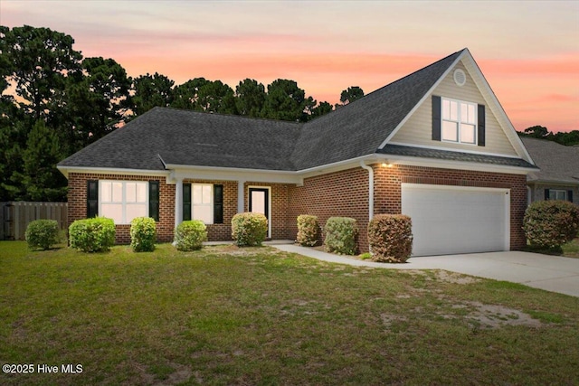 1009 Stonesthrow Ct, Leland, NC 28451 - traditional-style house featuring brick siding, driveway, roof with shingles, and a garage