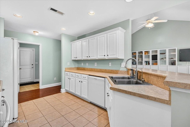 1009 Stonesthrow Ct, Leland, NC 28451 - kitchen with white appliances, white cabinetry, ceiling fan, light tile patterned floors, and light countertops