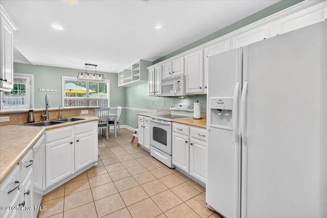 1009 Stonesthrow Ct, Leland, NC 28451 - kitchen featuring white appliances, white cabinetry, light tile patterned floors, light countertops, and recessed lighting