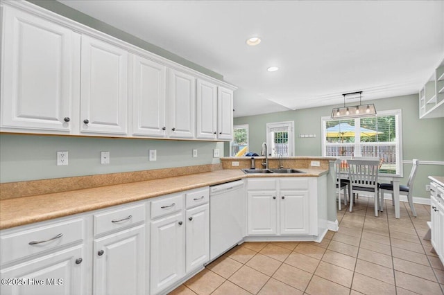 1009 Stonesthrow Ct, Leland, NC 28451 - kitchen featuring dishwasher, white cabinets, light tile patterned floors, recessed lighting, and light countertops