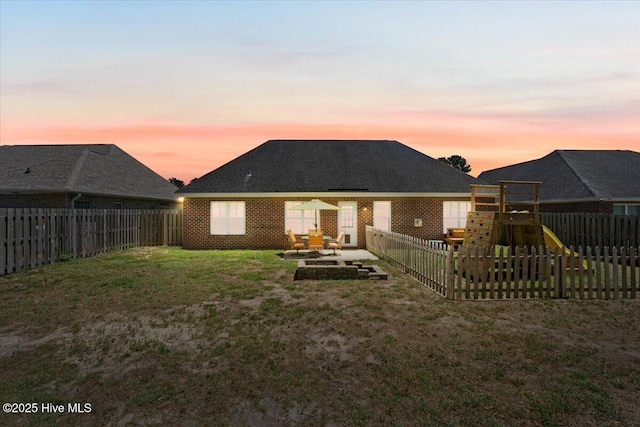 1009 Stonesthrow Ct, Leland, NC 28451 - back of house featuring a playground, a fenced backyard, and a patio area