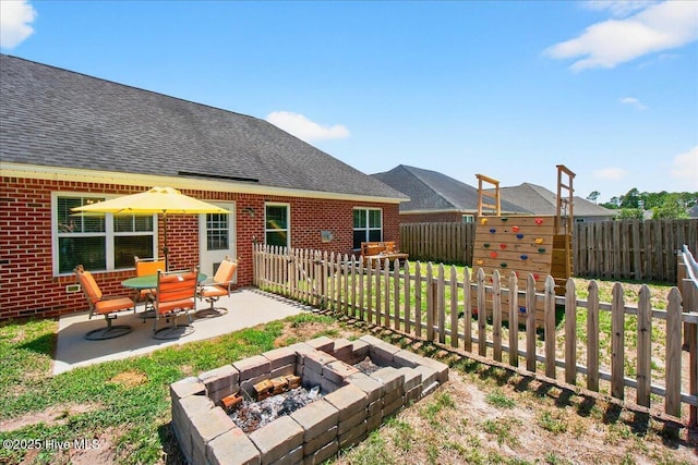 1009 Stonesthrow Ct, Leland, NC 28451 - fenced backyard with a patio area and a fire pit