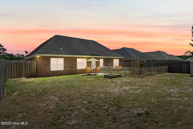 1009 Stonesthrow Ct, Leland, NC 28451 - back of house featuring a fenced backyard, a patio, and brick siding