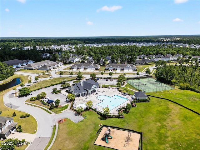 1009 Stonesthrow Ct, Leland, NC 28451 - aerial perspective of suburban area with a pool and a nearby body of water