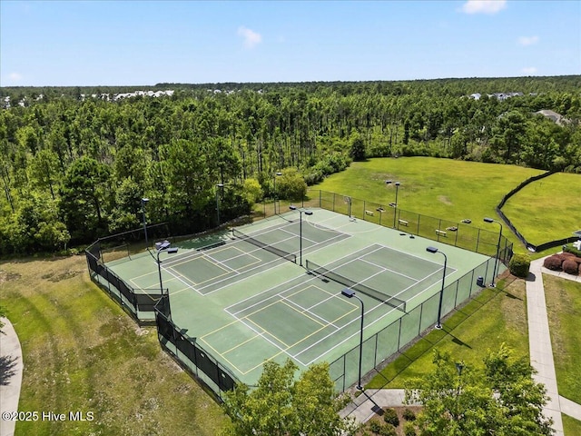 1009 Stonesthrow Ct, Leland, NC 28451 - view of tennis court with a wooded view