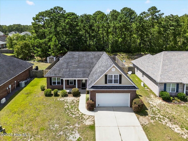 1009 Stonesthrow Ct, Leland, NC 28451 - view of front of home featuring driveway, brick siding, and an attached garage