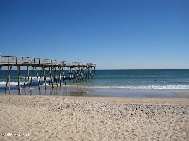1009 Stonesthrow Ct, Leland, NC 28451 - dock with view of water and beach and a pier