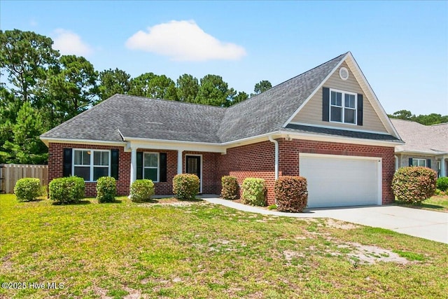 1009 Stonesthrow Ct, Leland, NC 28451 - view of front of house featuring brick siding, driveway, and a shingled roof