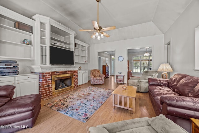 1910 Big Mill Rd, Williamston, NC 27892 - living room with wood finished floors, a ceiling fan, and a brick fireplace