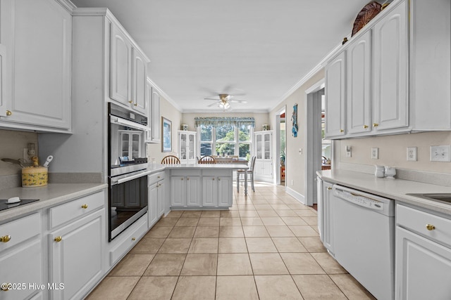 1910 Big Mill Rd, Williamston, NC 27892 - kitchen featuring white dishwasher, stainless steel double oven, ceiling fan, crown molding, and white cabinetry