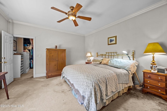 1910 Big Mill Rd, Williamston, NC 27892 - carpeted bedroom featuring ornamental molding, a spacious closet, a closet, and ceiling fan