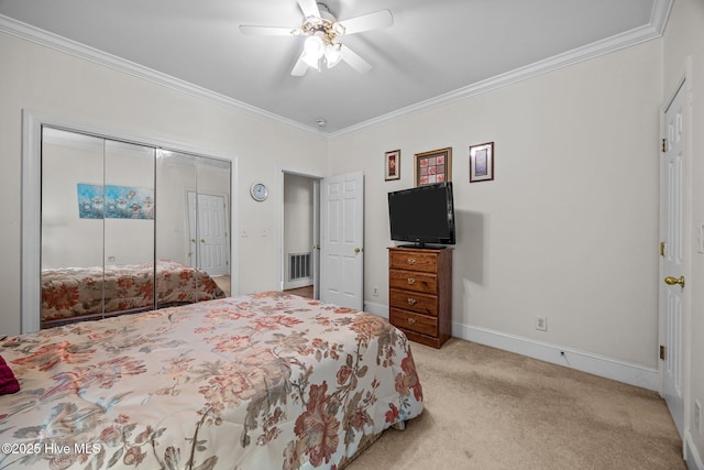 1910 Big Mill Rd, Williamston, NC 27892 - carpeted bedroom with a closet, crown molding, and ceiling fan