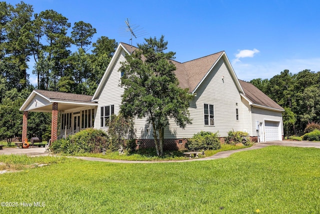 1910 Big Mill Rd, Williamston, NC 27892 - view of side of home with a yard, driveway, a garage, roof with shingles, and crawl space