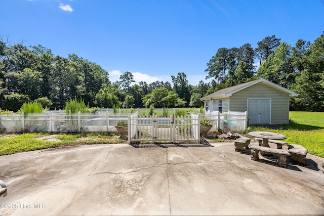1910 Big Mill Rd, Williamston, NC 27892 - view of patio with a fenced front yard and an outdoor structure