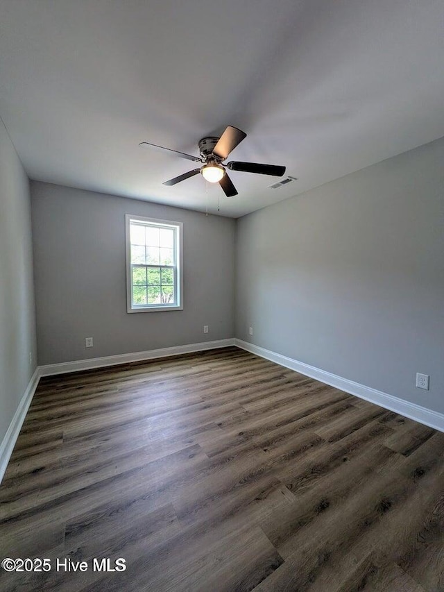353 N Stephens St, Southern Pines, NC 28387 - unfurnished room with ceiling fan, dark wood-type flooring, and baseboards