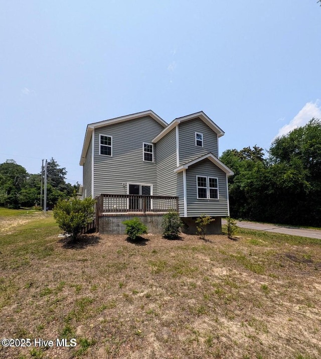 353 N Stephens St, Southern Pines, NC 28387 - view of side of property with a deck and a yard