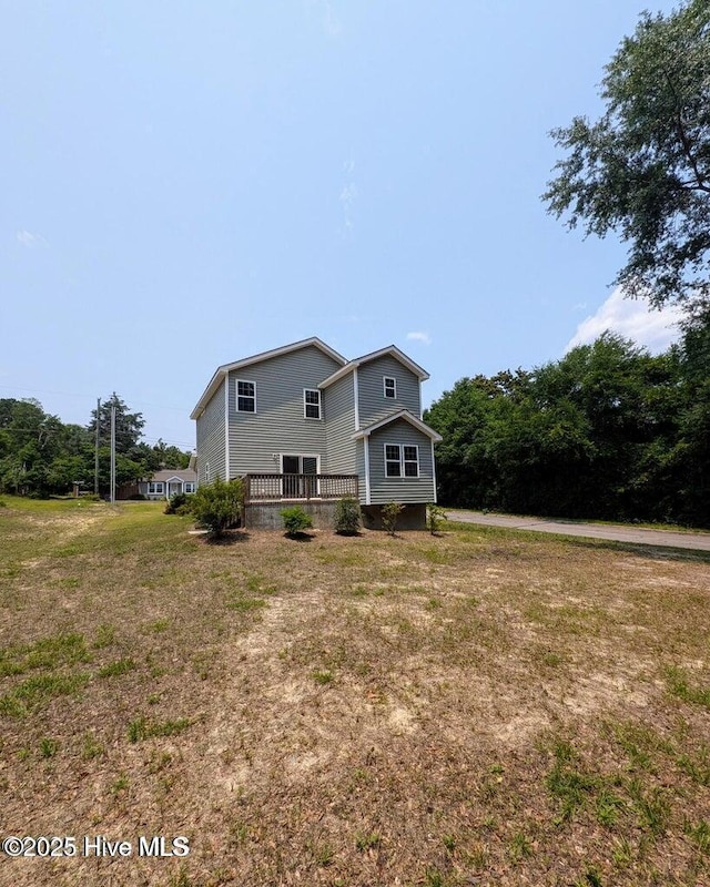 353 N Stephens St, Southern Pines, NC 28387 - rear view of house with a yard and a deck
