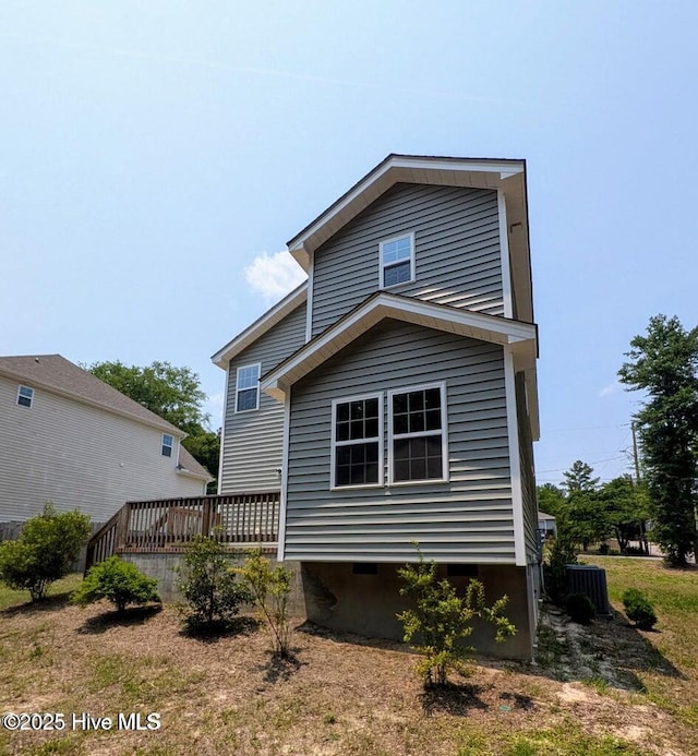 353 N Stephens St, Southern Pines, NC 28387 - rear view of property featuring a wooden deck, crawl space, and central AC unit