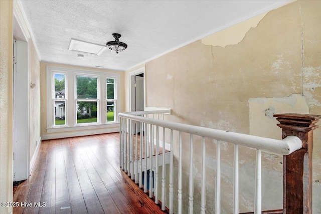 105 W Wayne St, Fremont, NC 27830 - corridor featuring hardwood / wood-style floors, an upstairs landing, and a textured ceiling