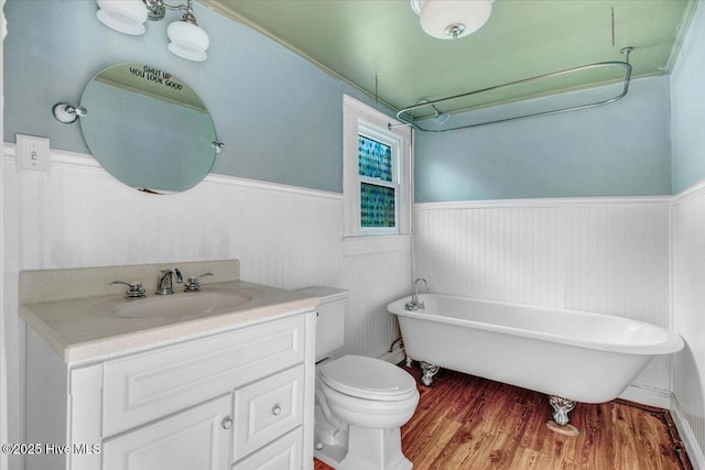 105 W Wayne St, Fremont, NC 27830 - full bath with a wainscoted wall, a freestanding tub, vanity, and wood finished floors