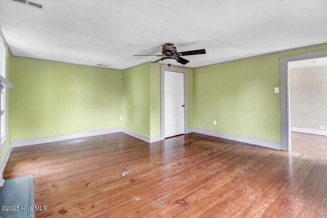 105 W Wayne St, Fremont, NC 27830 - unfurnished room with a ceiling fan, hardwood / wood-style floors, and a textured ceiling