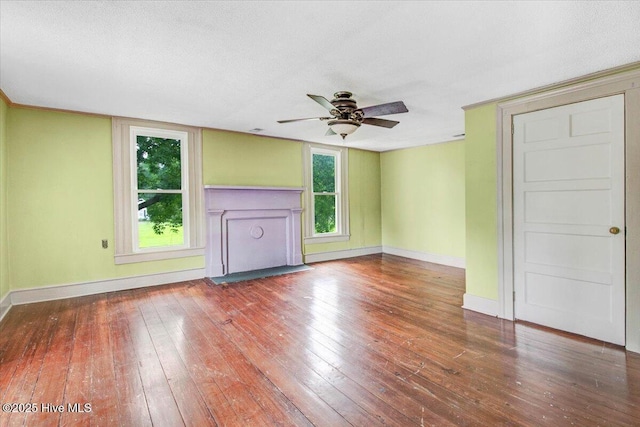 105 W Wayne St, Fremont, NC 27830 - unfurnished living room with wood-type flooring and a ceiling fan