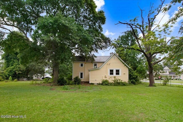 105 W Wayne St, Fremont, NC 27830 - view of side of home featuring a lawn
