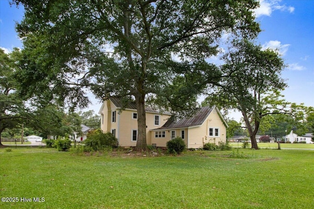 105 W Wayne St, Fremont, NC 27830 - view of property exterior featuring a lawn