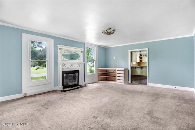 105 W Wayne St, Fremont, NC 27830 - unfurnished living room with crown molding, a fireplace with flush hearth, and carpet floors