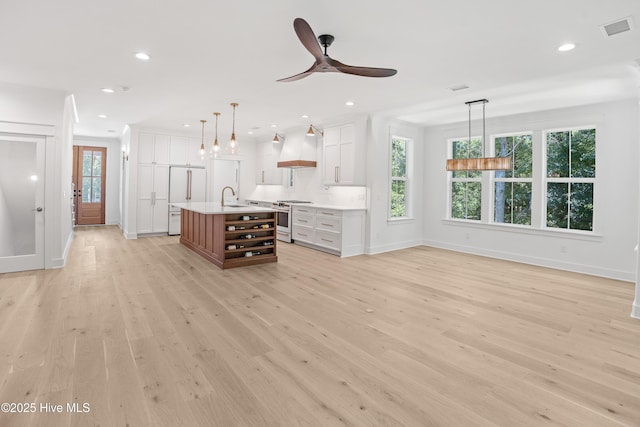 3404 Eagle Crest Dr SW, Supply, NC 28462 - unfurnished living room with light wood finished floors, plenty of natural light, a ceiling fan, and recessed lighting
