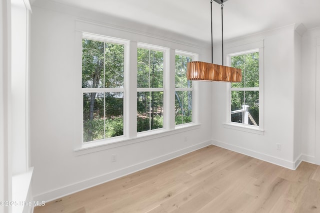 3404 Eagle Crest Dr SW, Supply, NC 28462 - unfurnished dining area featuring baseboards and light wood-style flooring